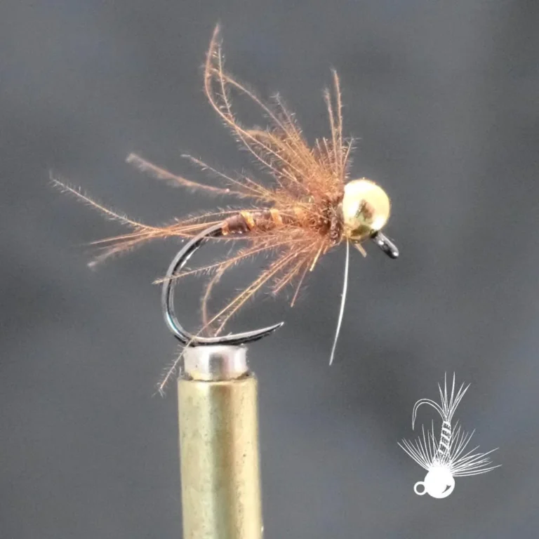 Cinnamon Orange and Gold Nymph fly in the vise
