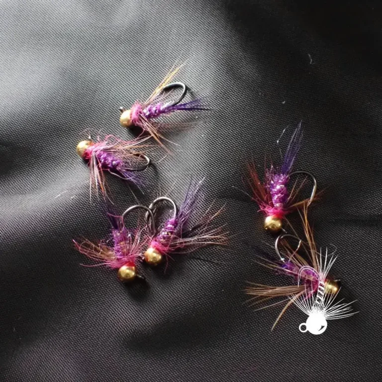 Purple Dart flies on a dark background